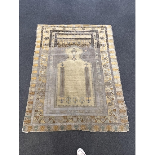 196 - A Turkish silk prayer rug, with mihrab and stylised foliate borders on a gold ground, 185 x 137cm... 