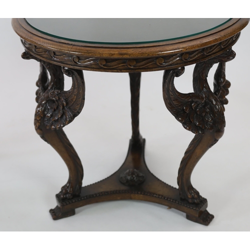 200 - A pair of walnut occasional tables with glass inset circular tops and triple winged eagle monopodia ... 