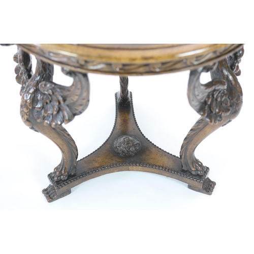 200 - A pair of walnut occasional tables with glass inset circular tops and triple winged eagle monopodia ... 