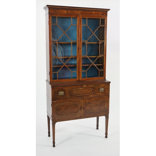 205 - A late George III mahogany secretaire bookcase, the moulded cornice with inlaid dentil work over two... 