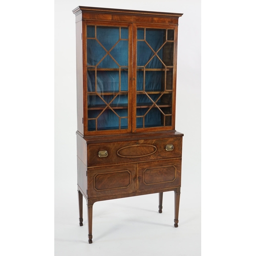 205 - A late George III mahogany secretaire bookcase, the moulded cornice with inlaid dentil work over two... 