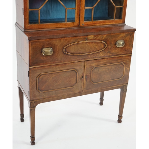 205 - A late George III mahogany secretaire bookcase, the moulded cornice with inlaid dentil work over two... 