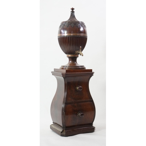 207 - An 18th century Dutch carved mahogany wine cooler and cover of urn form with brass tap, on bombé two... 