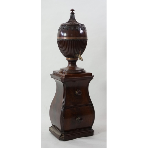 207 - An 18th century Dutch carved mahogany wine cooler and cover of urn form with brass tap, on bombé two... 