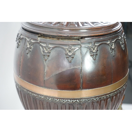 207 - An 18th century Dutch carved mahogany wine cooler and cover of urn form with brass tap, on bombé two... 