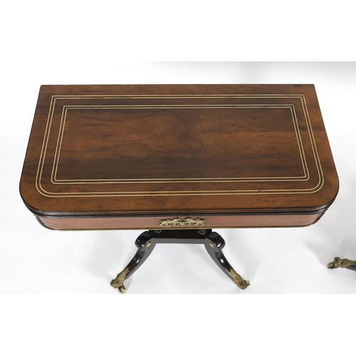 208 - A pair of Regency brass strung rosewood card tables with D shaped folding tops, ormolu mounted friez... 