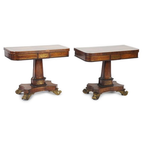 209 - A pair of Regency brass inset rosewood card tables inlaid throughout with foliate scrollwork, with f... 