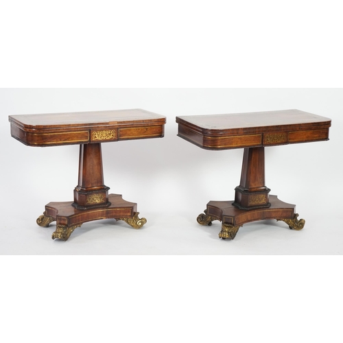 209 - A pair of Regency brass inset rosewood card tables inlaid throughout with foliate scrollwork, with f... 