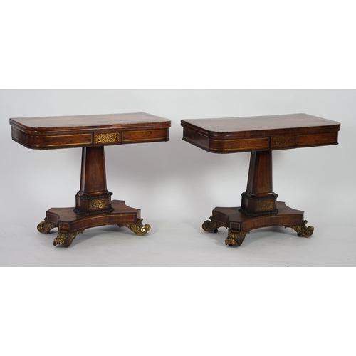 209 - A pair of Regency brass inset rosewood card tables inlaid throughout with foliate scrollwork, with f... 