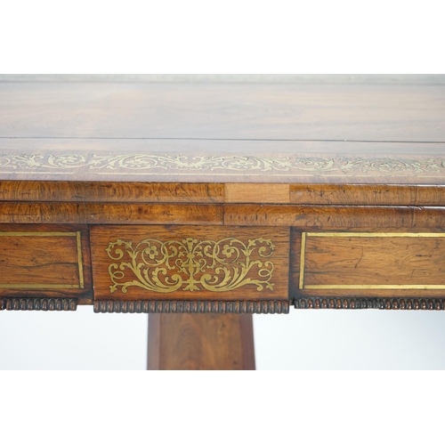 209 - A pair of Regency brass inset rosewood card tables inlaid throughout with foliate scrollwork, with f... 