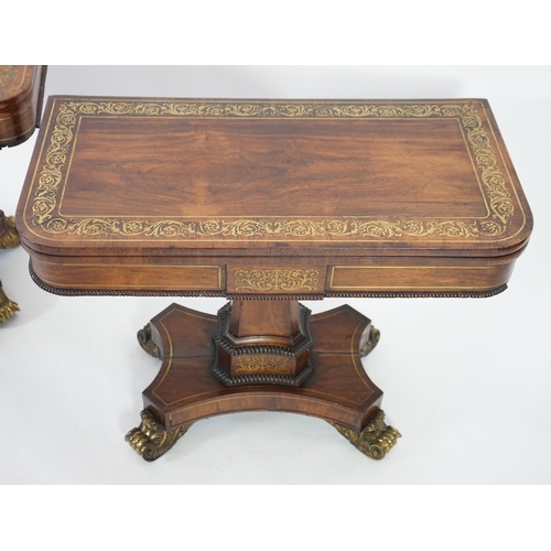 209 - A pair of Regency brass inset rosewood card tables inlaid throughout with foliate scrollwork, with f... 