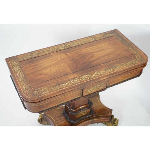 209 - A pair of Regency brass inset rosewood card tables inlaid throughout with foliate scrollwork, with f... 