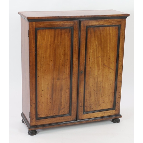 210 - An unusual William IV ebony and mahogany cigar cabinet with rectangular top and two panelled doors e... 