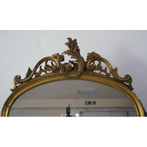 212 - A pair of late 19th century giltwood and gesso pier glasses with asymmetrical rococo scroll crests a... 