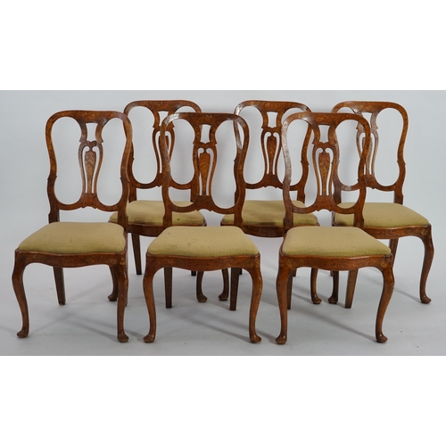 213 - A set of six 18th century Dutch walnut and marquetry dining chairs with floral inlaid hourglass shap... 