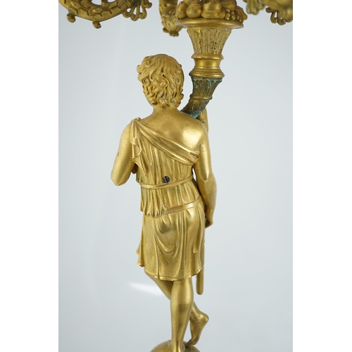 22 - After Pierre-Philippe Thomire (1751-1843), a pair of Regency French Empire five light candelabra wit... 