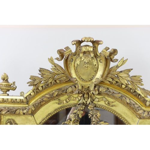 220 - A 19th century French carved giltwood wall mirror of architectural form with cartouche, laurel leaf ... 