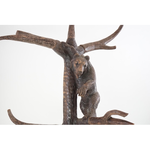 221 - A late 19th/early 20th century Swiss Black Forest carved wood hall stand, the mother bear depict... 