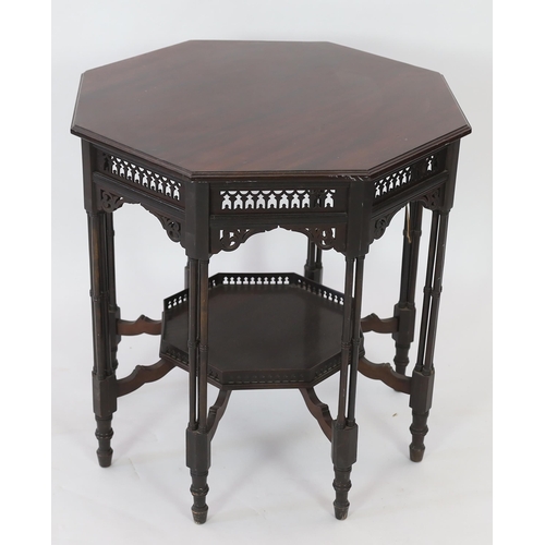 224 - Royal Furniture:  A late Victorian ebonised mahogany occasional table with octagonal top, fretwork f... 