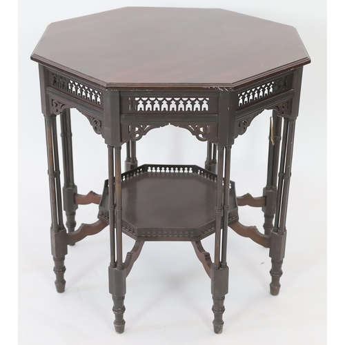 224 - Royal Furniture:  A late Victorian ebonised mahogany occasional table with octagonal top, fretwork f... 