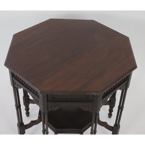 224 - Royal Furniture:  A late Victorian ebonised mahogany occasional table with octagonal top, fretwork f... 