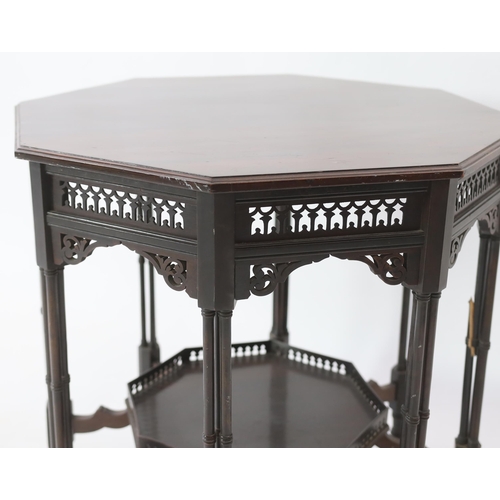 224 - Royal Furniture:  A late Victorian ebonised mahogany occasional table with octagonal top, fretwork f... 