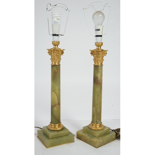 23 - A pair of Victorian ormolu mounted green onyx table lamps of Corinthian column form, with stepped ba... 