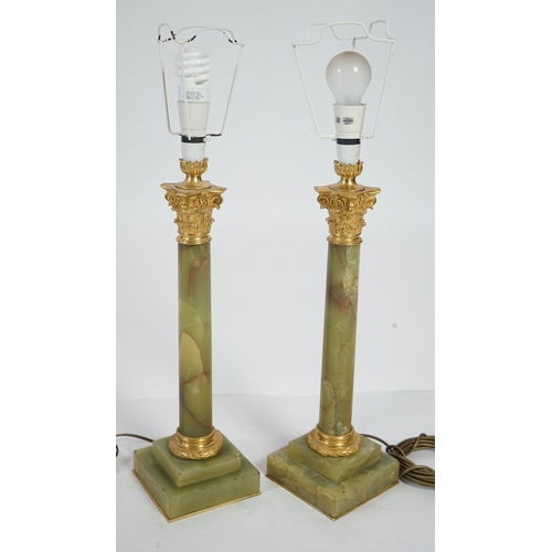 23 - A pair of Victorian ormolu mounted green onyx table lamps of Corinthian column form, with stepped ba... 