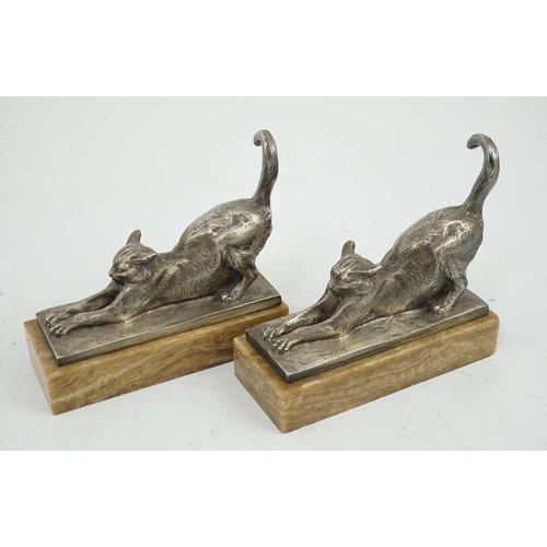 39 - Louis Riché (French, 1877-1949), a pair of silvered bronze bookends modelled as stretching cats, sig... 