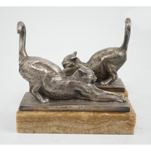 39 - Louis Riché (French, 1877-1949), a pair of silvered bronze bookends modelled as stretching cats, sig... 