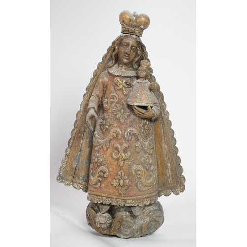 4 - A late 18th century Spanish polychrome oak group of the Madonna and child, with remnants of parcel g... 