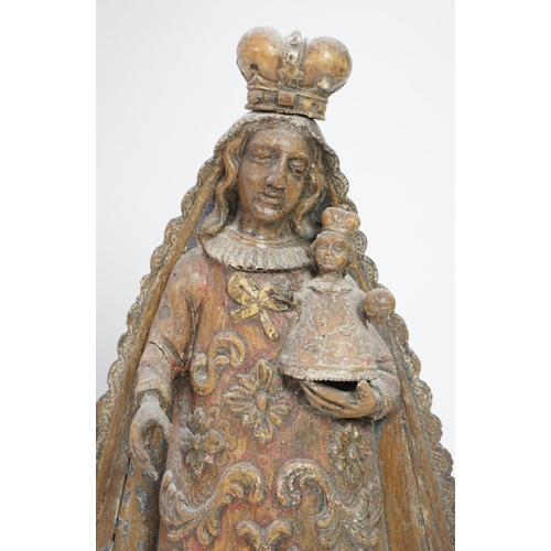 4 - A late 18th century Spanish polychrome oak group of the Madonna and child, with remnants of parcel g... 