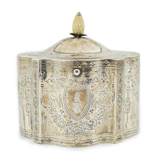 421 - A George III engraved silver tea caddy, by Benjamin Mountigue, of serpentine form, with carved ivory... 