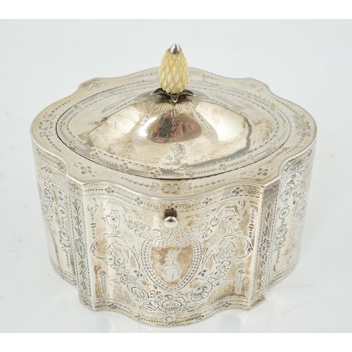 421 - A George III engraved silver tea caddy, by Benjamin Mountigue, of serpentine form, with carved ivory... 