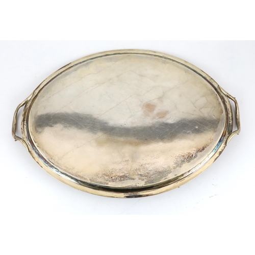 422 - A George III silver oval two handled tea tray by William Bennett, with reeded handles and border, Lo... 