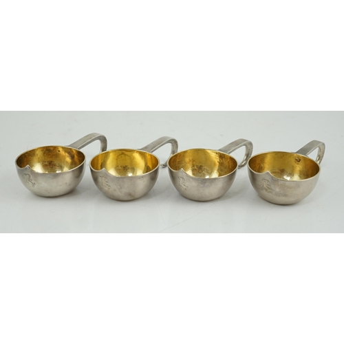 438 - A set of four late 19th century Russian 84 zolotnik silver kovsh cups, with engraved initials, unkno... 