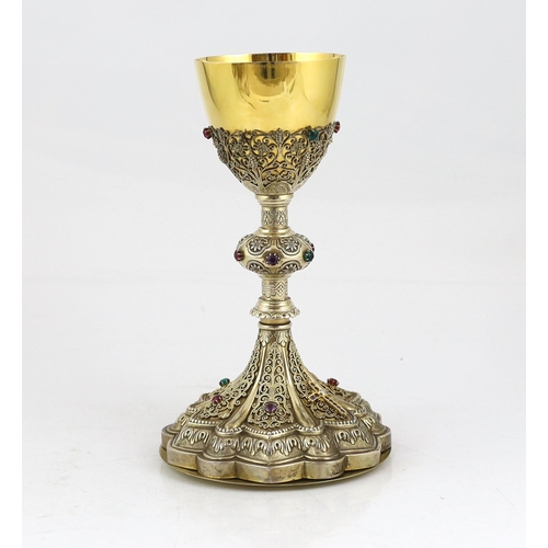 464 - A late 19th/early 20th century American Eucharistic 14kt gold, silver gilt and multi coloured paste ... 