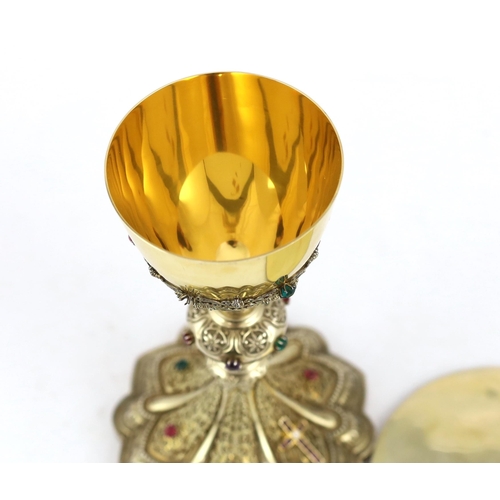 464 - A late 19th/early 20th century American Eucharistic 14kt gold, silver gilt and multi coloured paste ... 