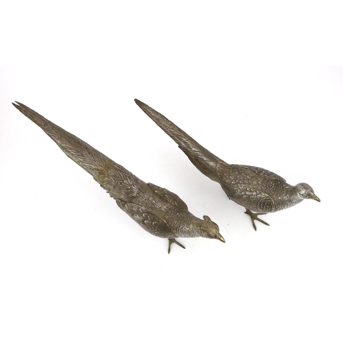 467 - A large pair of German 800 standard silver free standing model pheasants with articulated wings, c.1... 