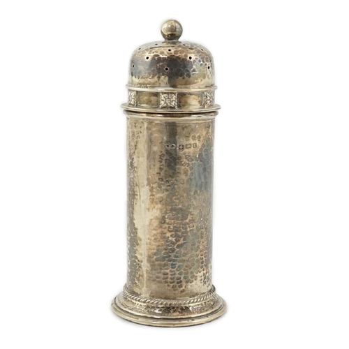 469 - A George V Arts & Crafts planished silver sugar castor by Albert Edward Jones, of lighthouse form, B... 