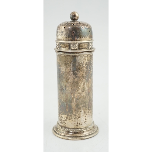 469 - A George V Arts & Crafts planished silver sugar castor by Albert Edward Jones, of lighthouse form, B... 