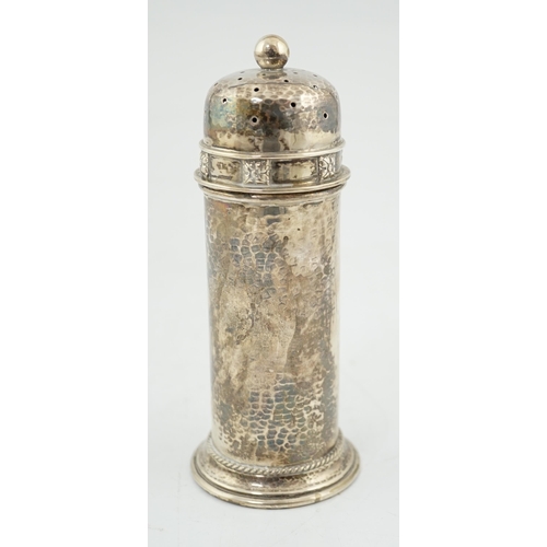 469 - A George V Arts & Crafts planished silver sugar castor by Albert Edward Jones, of lighthouse form, B... 