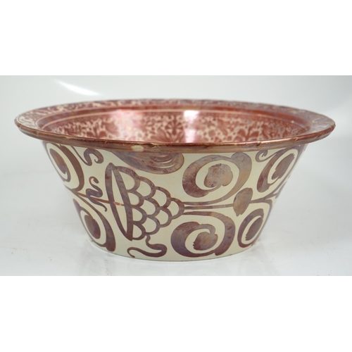 47 - Ulisse Cantagalli, a large Hispano-Moresque style ruby-copper lustre basin, c.1900, decorated with s... 