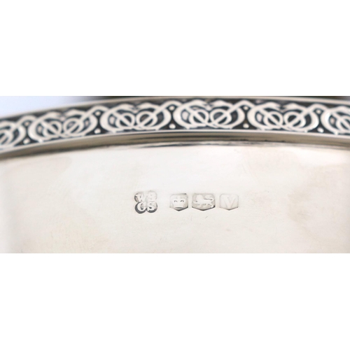 471 - A George V Arts & Crafts silver circular bowl, by W & C Sissons, with Celtic revival border, on a pi... 