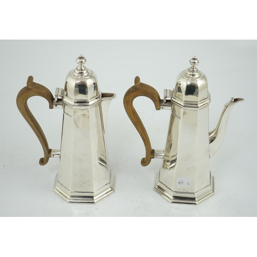 474 - A George V 18th century style silver cafe au lait pair by Garrard & Co, London, 1923 & 1926, height ... 