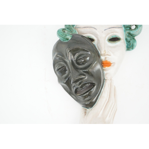 50 - An Art Deco tin-glazed terracotta theatrical wall mask, by Goldscheider, black printed mark Goldsch... 