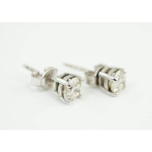 590 - A pair of 18k white gold and solitaire diamond set ear studs, the stone diameter approximately 5.4mm... 