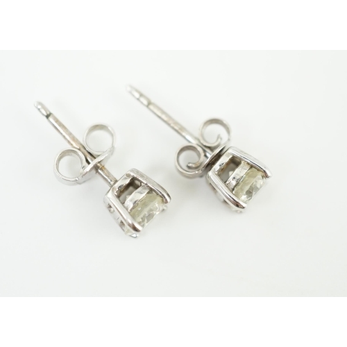 590 - A pair of 18k white gold and solitaire diamond set ear studs, the stone diameter approximately 5.4mm... 