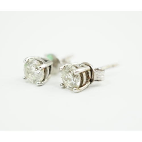 590 - A pair of 18k white gold and solitaire diamond set ear studs, the stone diameter approximately 5.4mm... 