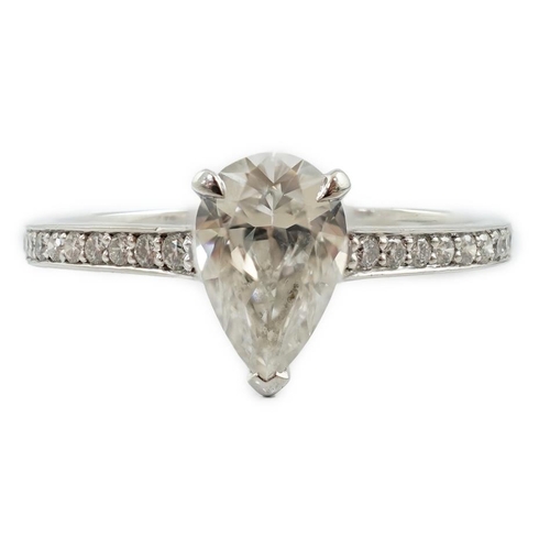 591 - A recent Boodles platinum and single stone pear cut diamond set Harmony design ring, with diamond ch... 